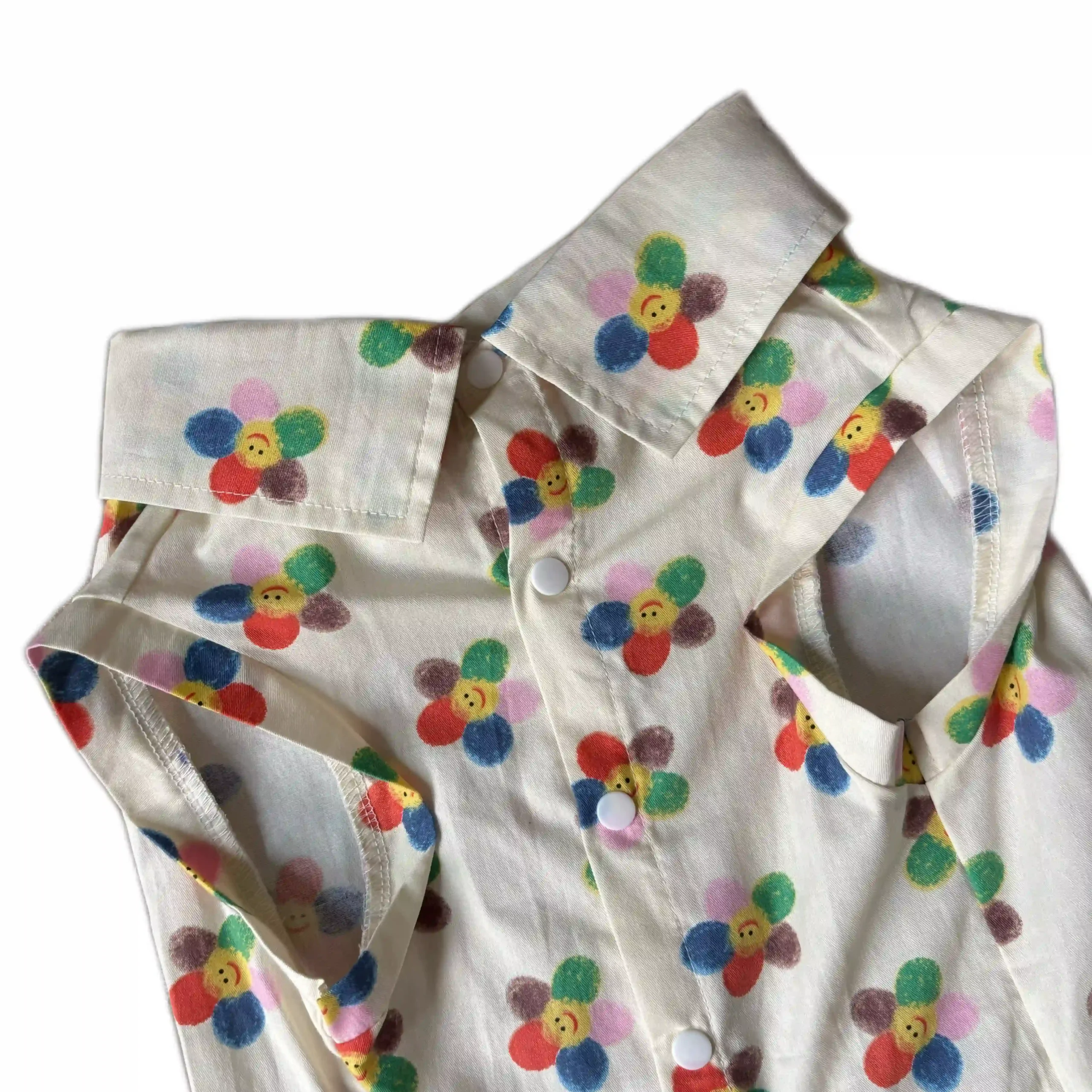 Close-up fabric of Vibrant Summer Pet Clothes smiling floral shirt