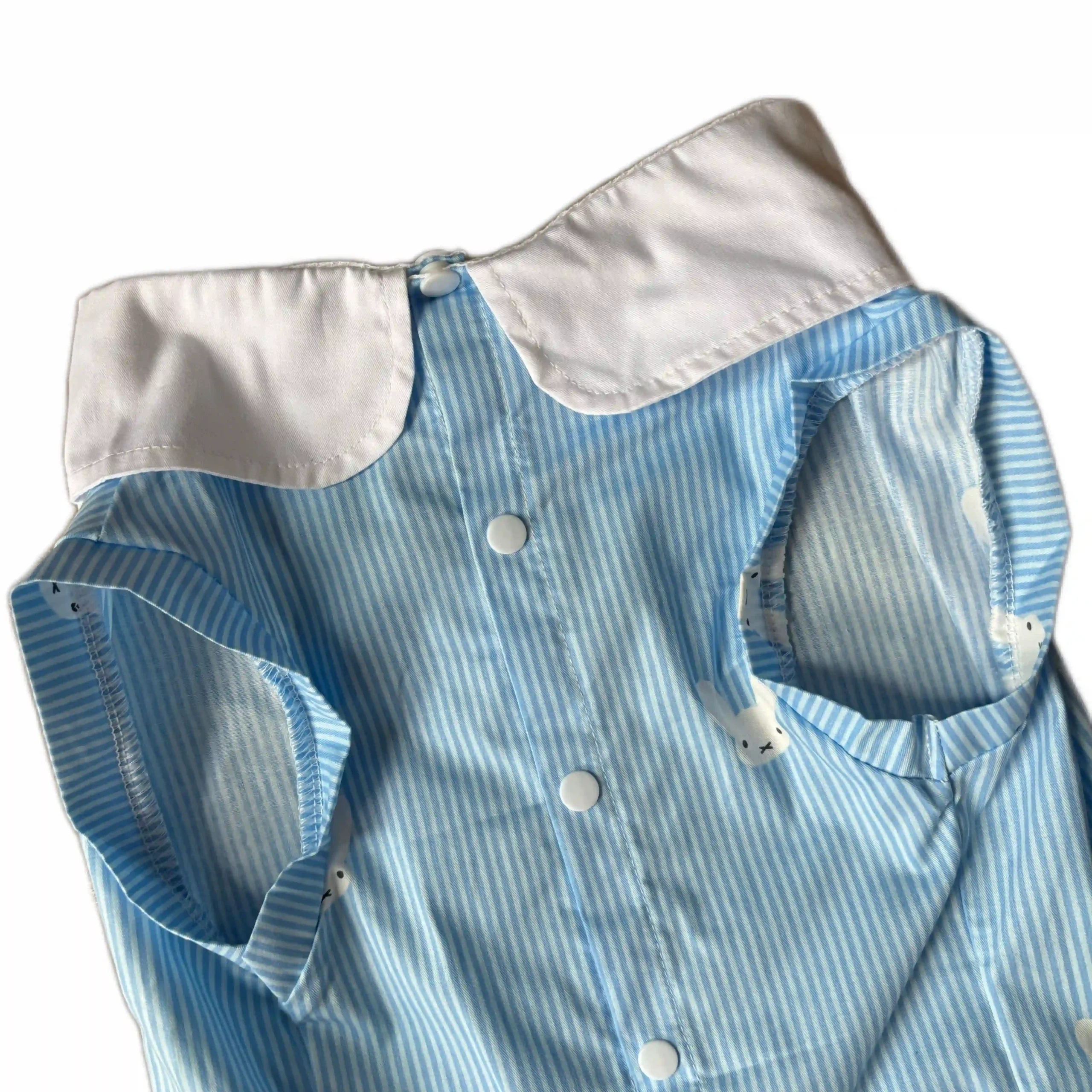 Macro fabric detail of blue bunny striped pet wear