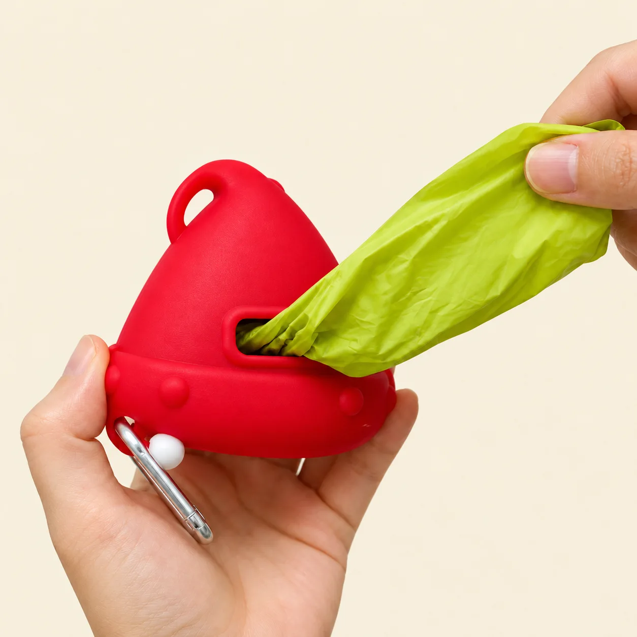 Waste bag being pulled from the back of a Santa dog waste bag dispenser